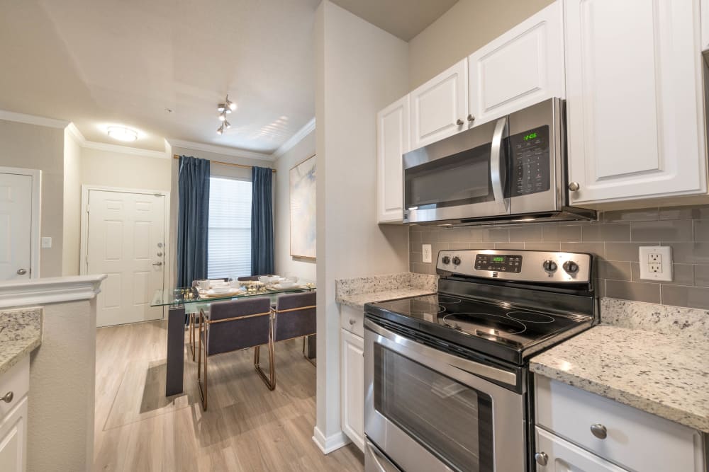 Stainless-steel appliances in a model home's kitchen at Olympus Town Center in Keller, Texas