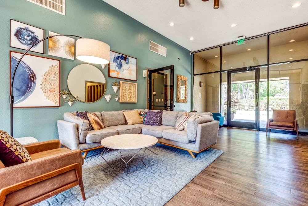 Comfortable lobby space with couch and chairs at Waterstone Fremont in Fremont, California