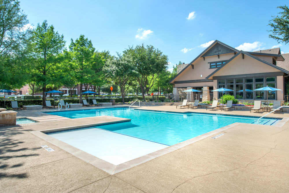 Swimming pool with a sun deck at Olympus Town Center in Keller, Texas