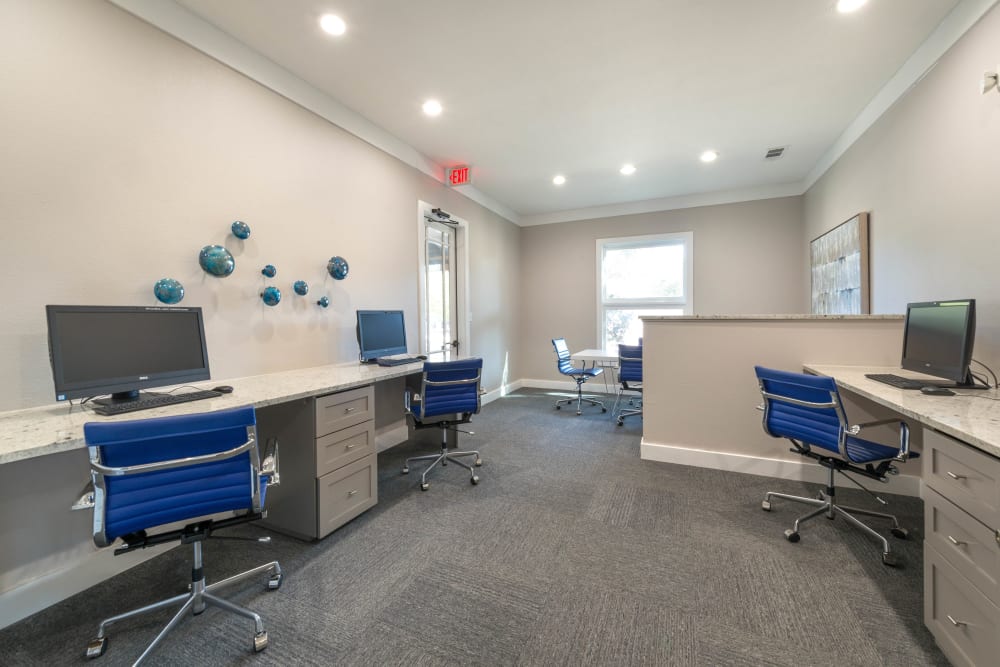 Business center with computers for resident use at Olympus Town Center in Keller, Texas