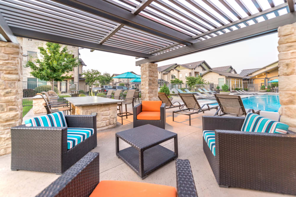 Pergola over an outdoor lounge area at Olympus Waterford in Keller, Texas