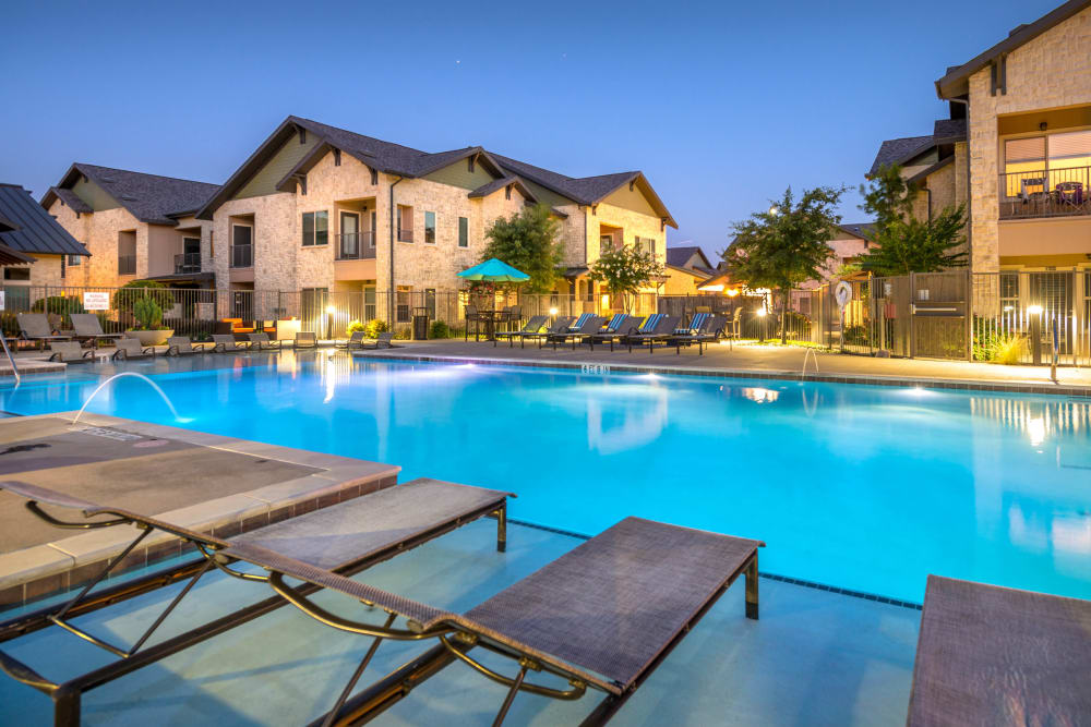 Twilight at the swimming pool area at Olympus Waterford in Keller, Texas