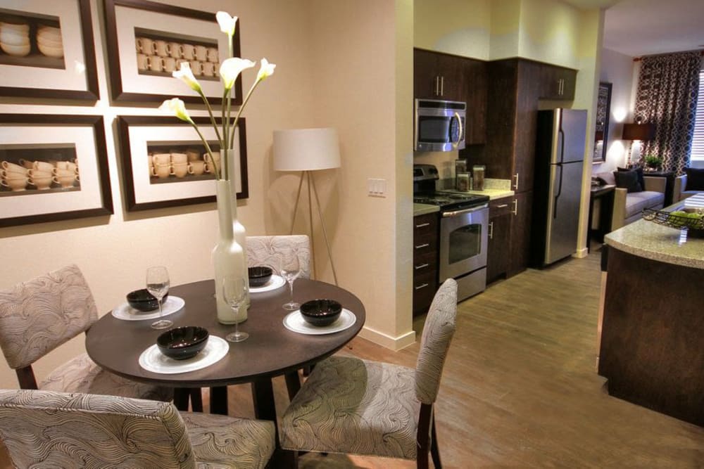 View of the gourmet kitchen from the dining area of a model apartment at Redstone at SanTan Village in Gilbert, Arizona