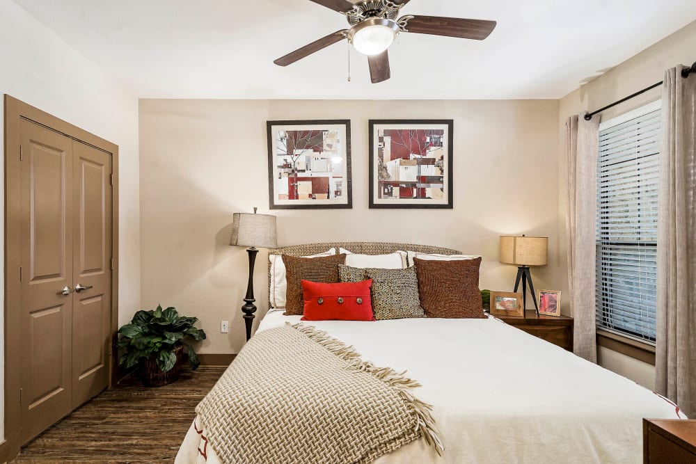Ceiling fan in the well-furnished bedroom of a model apartment at Sedona Ranch in Odessa, Texas