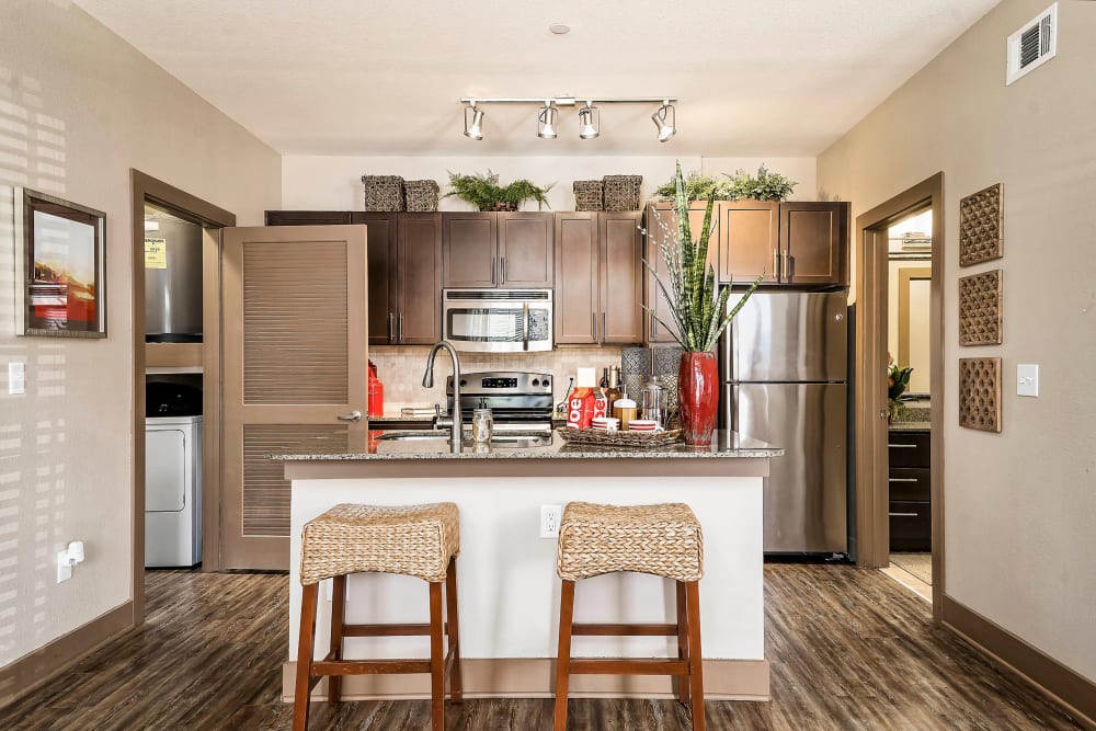 Bar seating at a model home's kitchen island at Sedona Ranch in Odessa, Texas