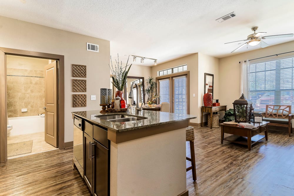 View of the living area from the open-concept kitchen of a model home at Sedona Ranch in Odessa, Texas