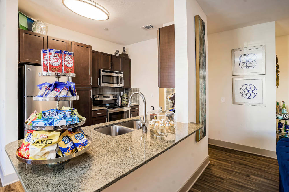 Gourmet kitchen with a breakfast bar in a model home at Sundance Creek in Midland, Texas