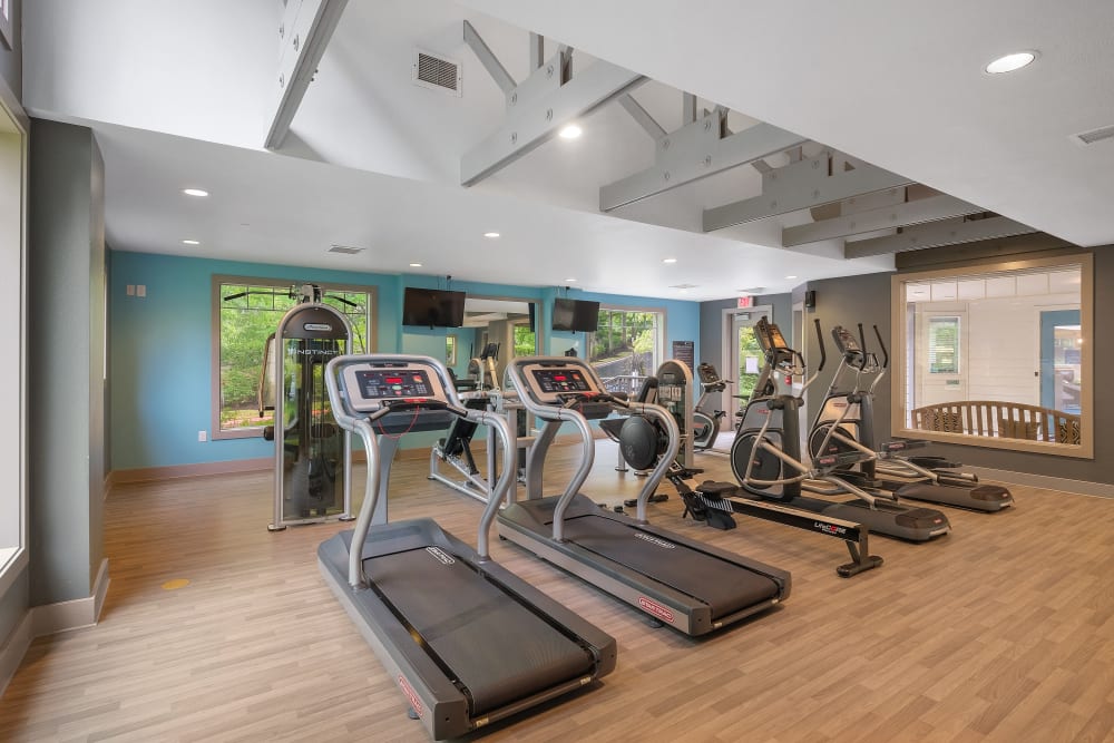Fitness center with individual workout stations at Waterhouse Place in Beaverton, Oregon