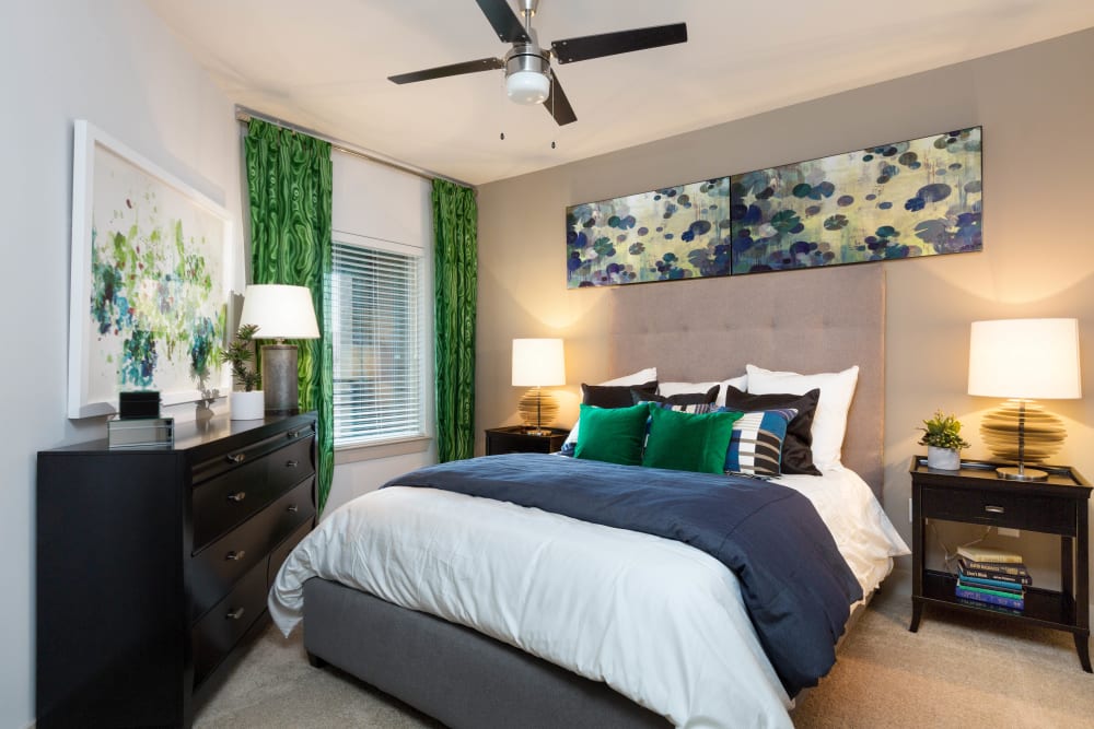 Ceiling fan and plush carpeting in a model apartment at The Davis in Fort Worth, Texas