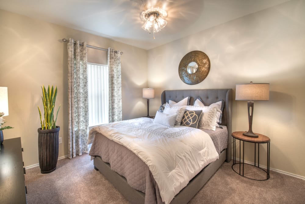 Ceiling fan and plush carpeting in a model home's bedroom at The Ranch at Shadow Lake in Houston, Texas