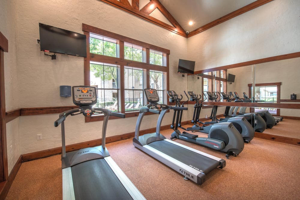 Ample cardio machines in the fitness center at The Ranch at Shadow Lake in Houston, Texas