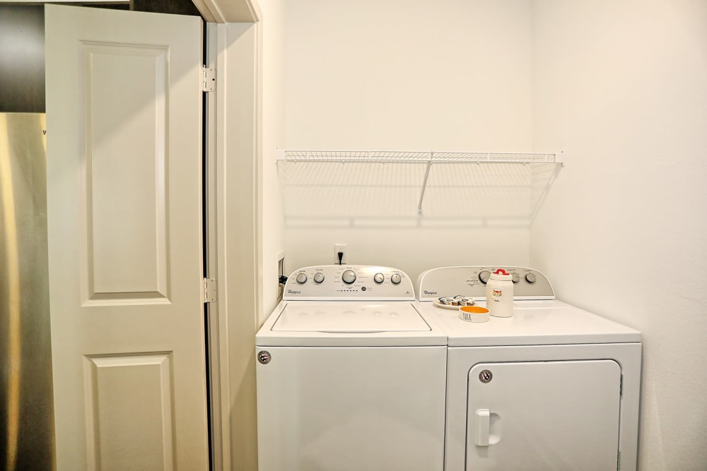 Full-size in-unit washer and dryer in a model apartment at The Slate in Savannah, Georgia