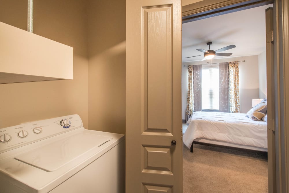 In-unit washer and dryer in a model apartment at Union At Carrollton Square in Carrollton, Texas