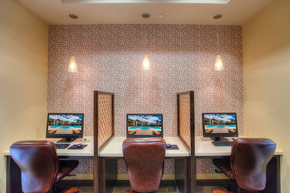 Business center with multiple workstations for resident use at Vistara at SanTan Village in Gilbert, Arizona