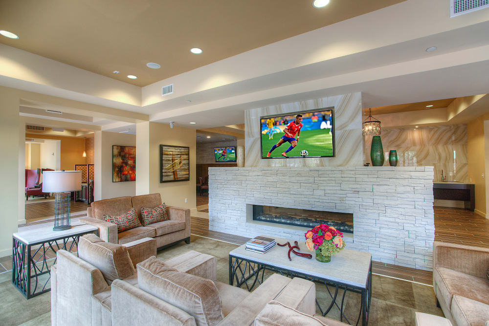 Flatscreen TVs and comfortable lounge areas in the clubhouse at Vistara at SanTan Village in Gilbert, Arizona