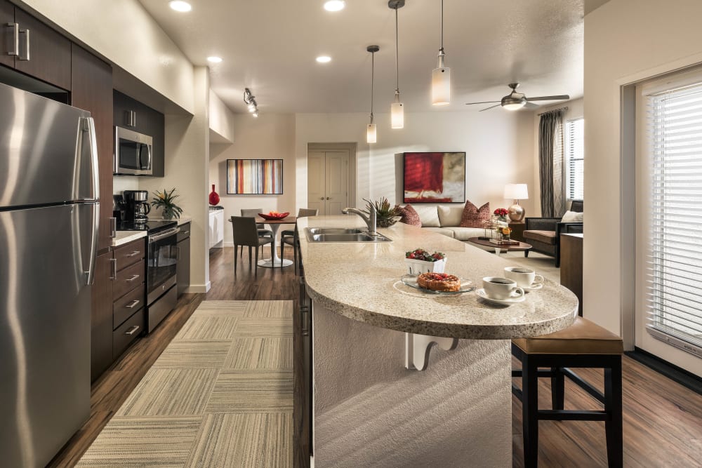 Beautiful gourmet kitchen with an island in a model home at Vistara at SanTan Village in Gilbert, Arizona