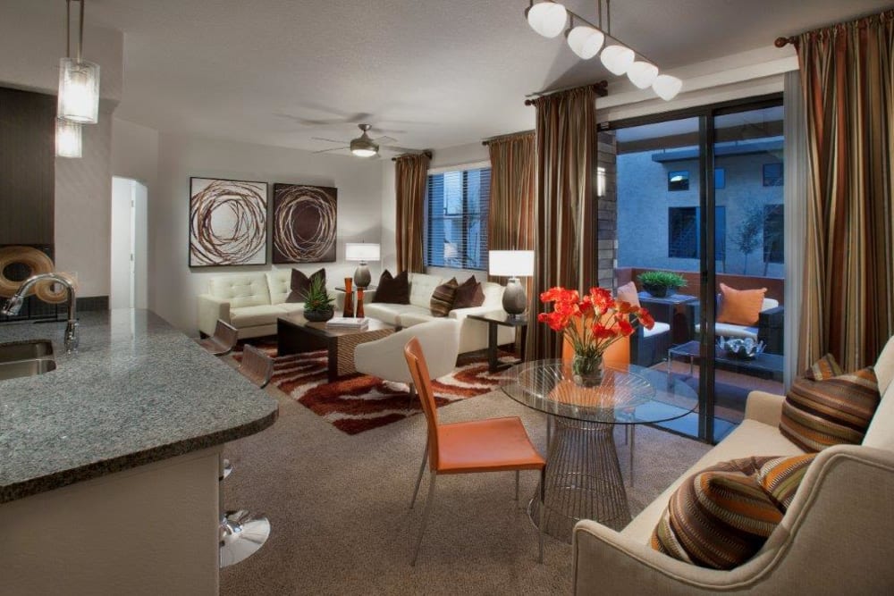 Plush carpeting throughout the living areas of a model apartment at Vive in Chandler, Arizona