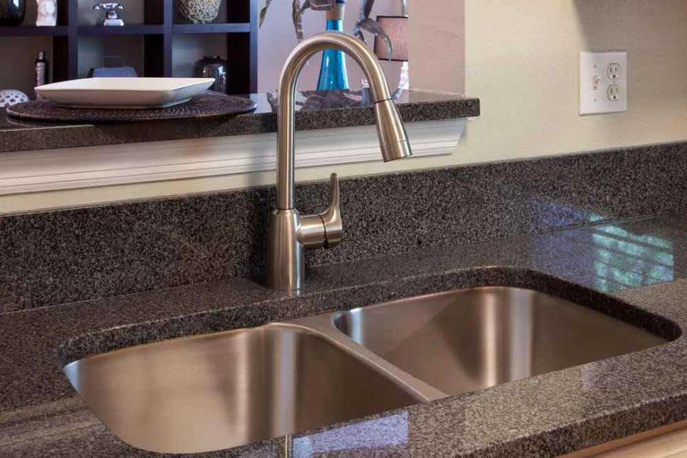 Dual-basin recessed sink in a model apartment's kitchen at Wimberly at Deerwood in Jacksonville, Florida
