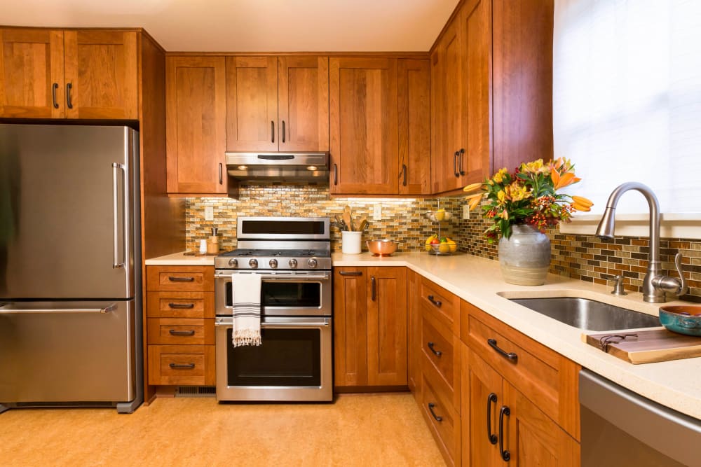 Modern kitchen in a model home at Olympus Court Apartments in Bakersfield, California