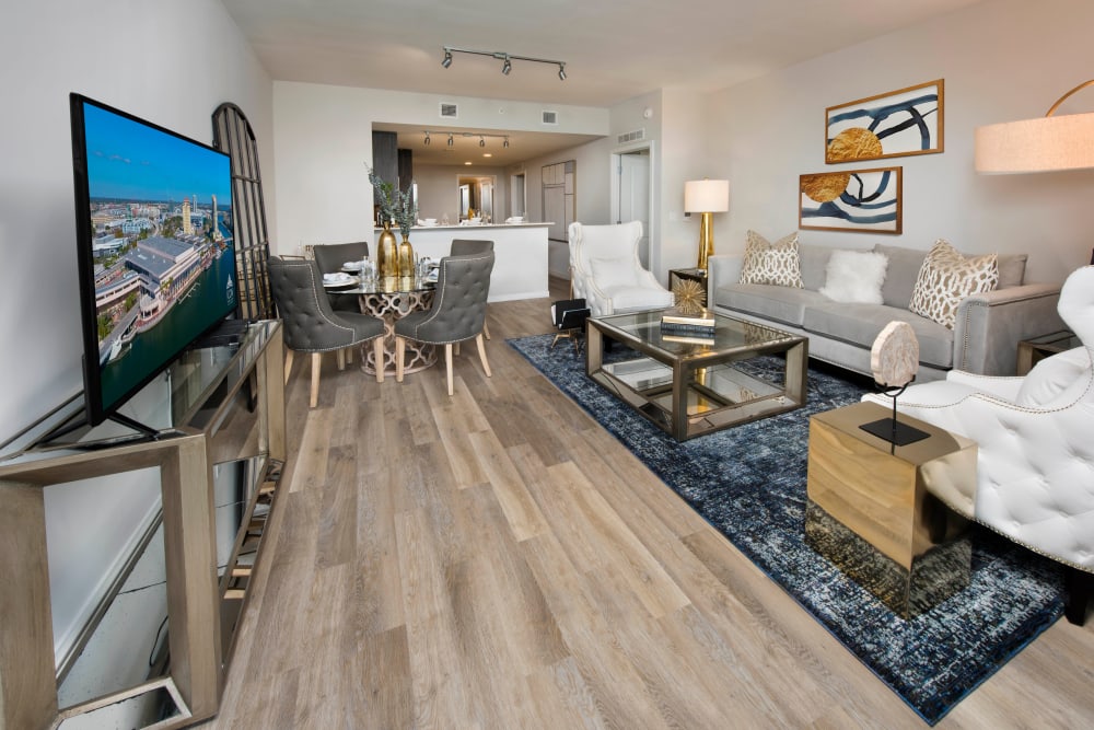 Spacious open-concept model home with hardwood floors in the living area at Olympus Harbour Island in Tampa, Florida