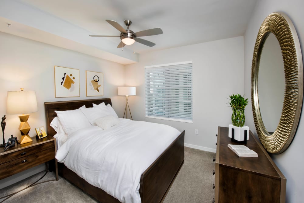 Ceiling fan and plush carpeting in a model apartment's bathroom at Olympus Harbour Island in Tampa, Florida