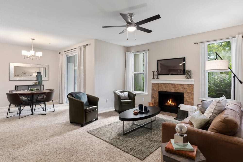 Dining room and living room with natural lighting at HighGrove Apartments in Everett, Washington