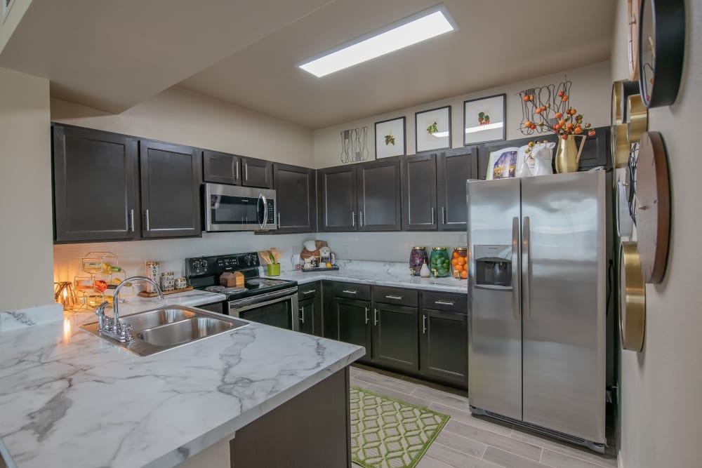 Fully equipped kitchen at Bend at New Road Apartments in Waco, Texas