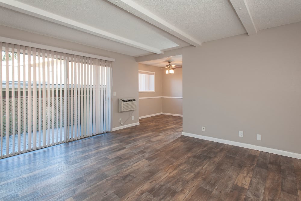 Living room with patio access at Shadow Oaks Apartment Homes in Cupertino, California
