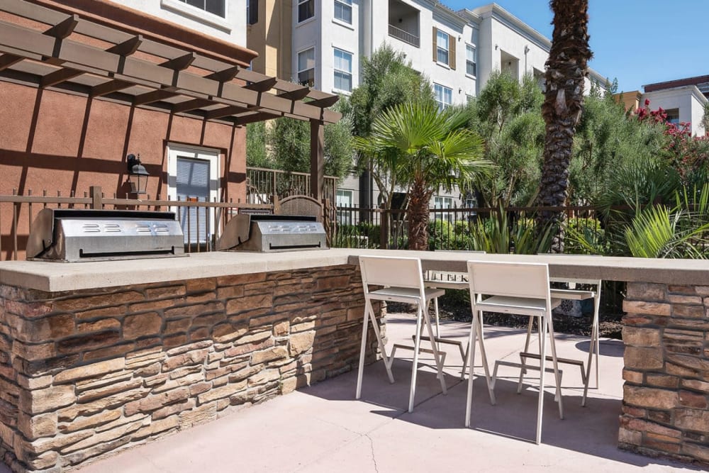 Barbecue grills next to tables for entertaining guests at Park Central in Concord, California
