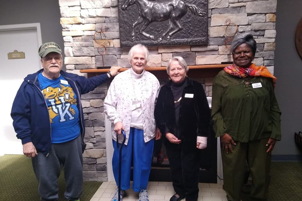 Residents pose in front of the fireplace at Willow Creek Senior Living in Elizabethtown, Kentucky.