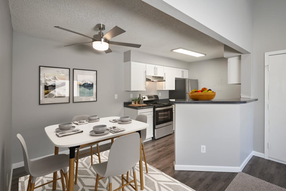 Kitchen with wood-style flooring at Alton Green Apartments in Denver, Colorado