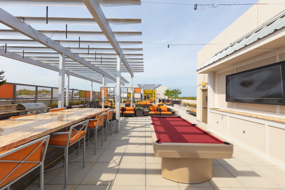 Outdoor pool table at Palette at Arts District in Hyattsville, Maryland