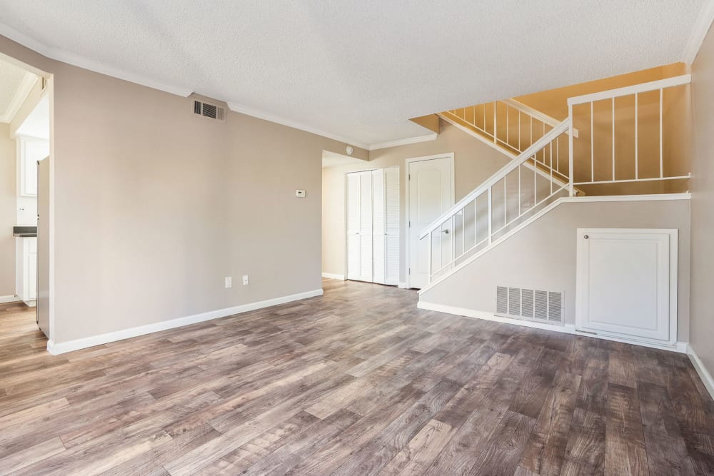 Large living room with wood-style flooring at Ridgecrest Apartment Homes in Martinez, California