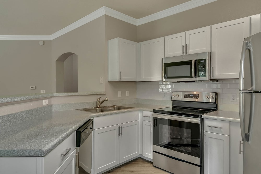 Modern kitchen in model apartment home at Palms at World Gateway in Orlando, Florida