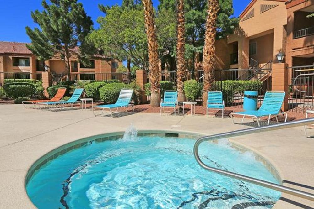 Spa with nearby lounge chairs at Alterra Apartments in Las Vegas, Nevada