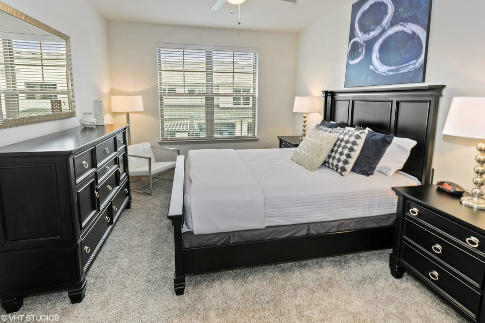 Apartment master bedroom at The Luxe at Cedar Hill in Cedar Hill, Texas