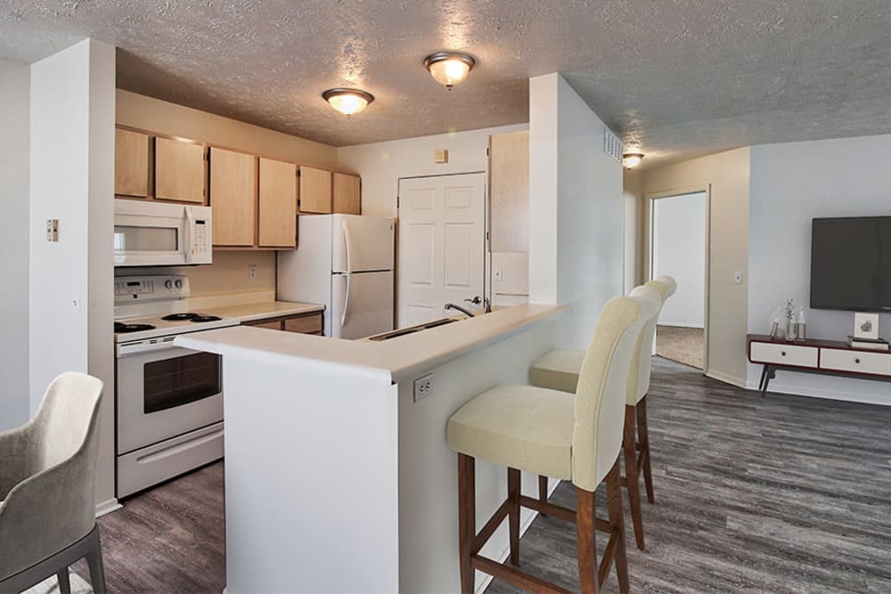 Modern kitchen with a breakfast bar at Westview Commons Apartments in Rochester, New York