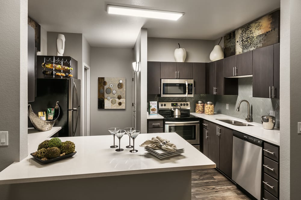 Gourmet kitchen in model home at Avenue 25 Apartments in Phoenix, Arizona