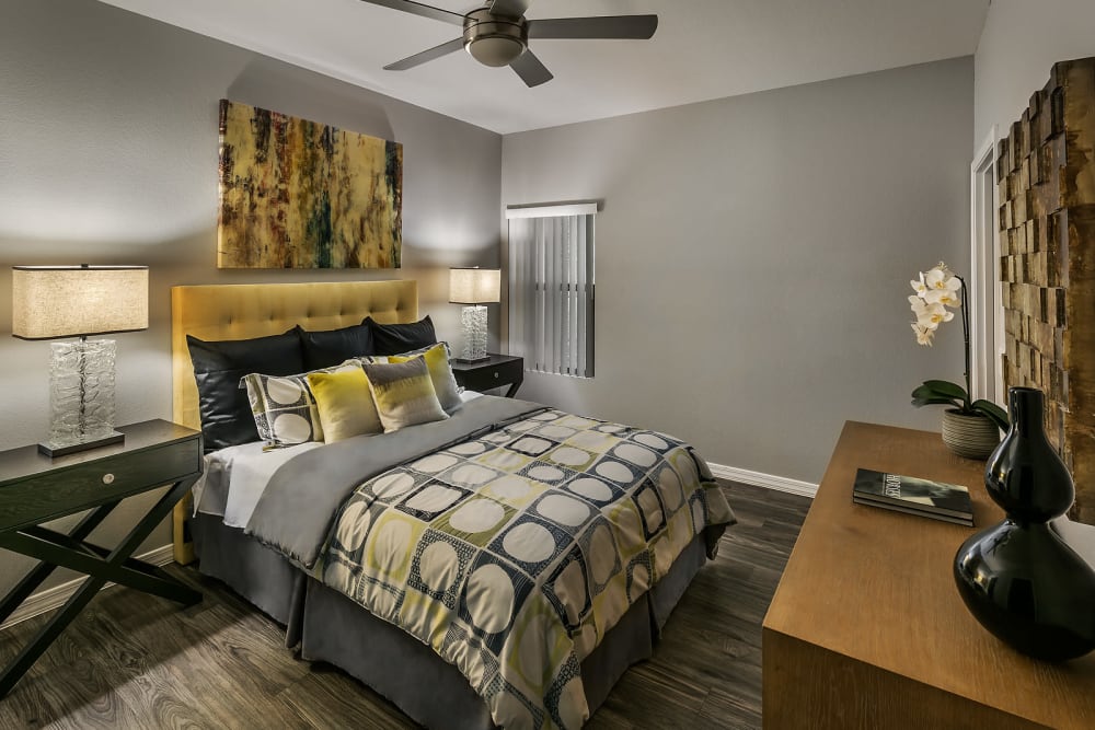 Master bedroom with a window at Avenue 25 Apartments in Phoenix, Arizona