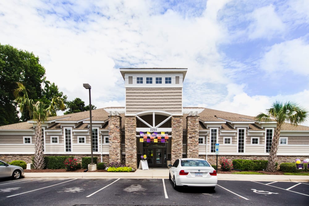 Parking lot and leasing office at Sunchase Apartments in Greenville, North Carolina