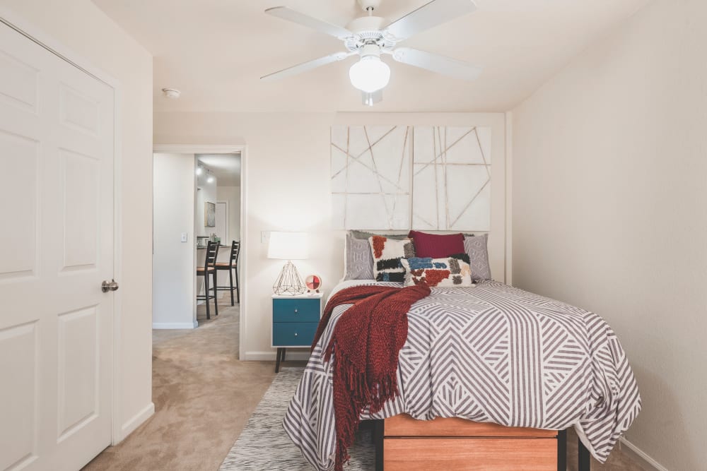 Well-lit bedroom at Sunchase Apartments in Greenville, North Carolina