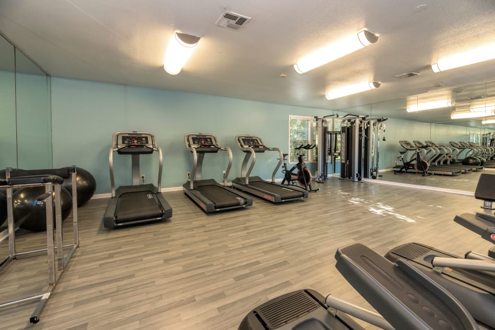 Fitness center with plenty of workout stations at Sterling Heights Apartment Homes in Benicia, California