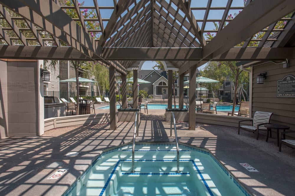 Large hot tub with a gazebo at The Reserve at Capital Center Apartment Homes in Rancho Cordova, California