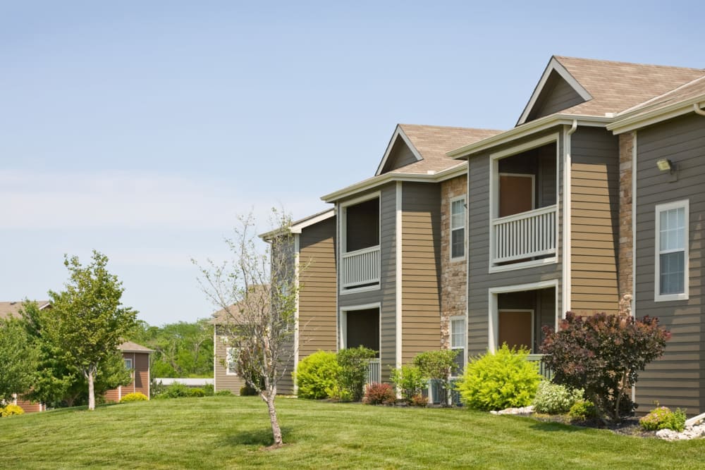 Professionally maintained landscaping outside resident buildings at Timber Lakes Apartment Homes in Kansas City, Missouri