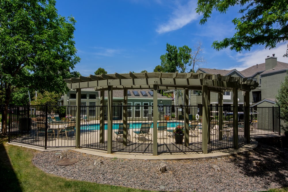 Pergola provides some shade near the pool at Waterfield Court Apartment Homes in Aurora, Colorado