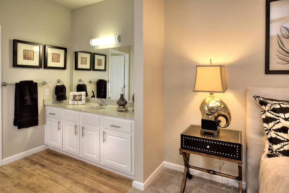 Spacious master bedroom with bathroom storage at River Oaks Apartment Homes in Vacaville, California