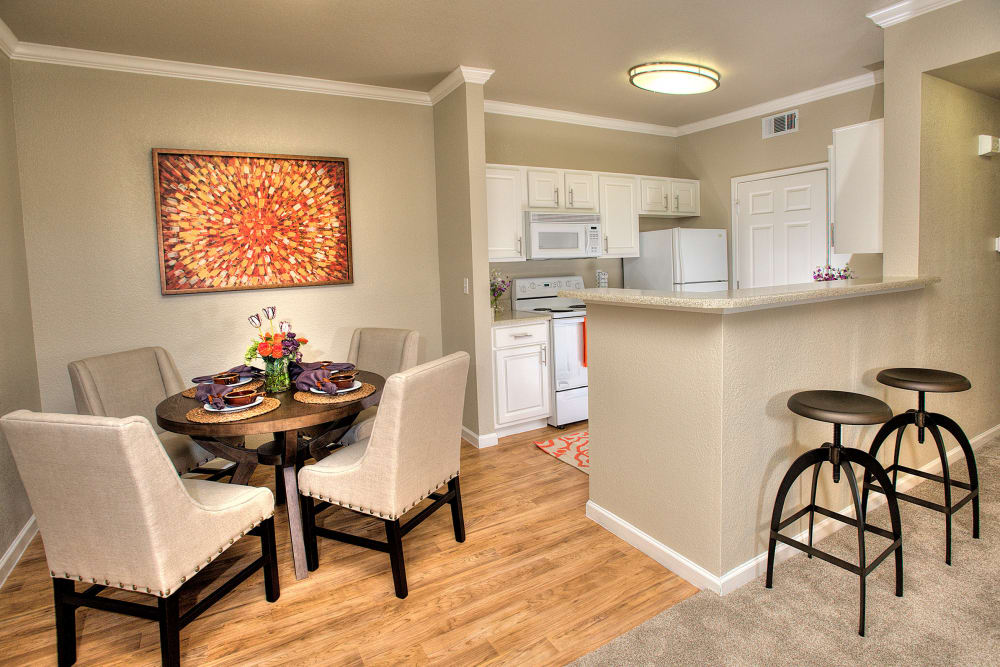 Kitchen with a breakfast bar at River Oaks Apartment Homes in Vacaville, California