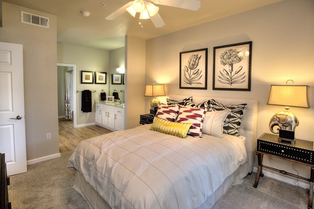 Spacious master bedroom with plush carpeting at River Oaks Apartment Homes in Vacaville, California