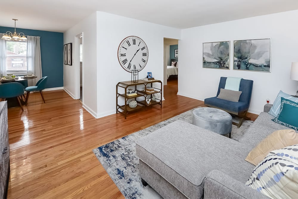 Spacious living room with hardwood floors at Elmwood Village Apartments & Townhomes in Elmwood Park, New Jersey