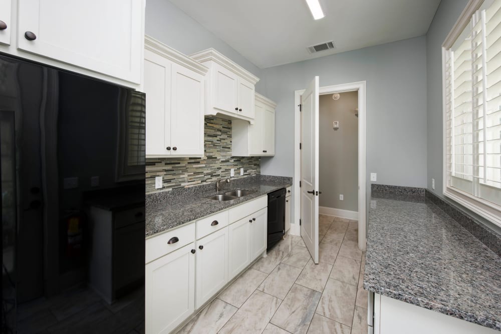 Subway tile backsplash in a model home's kitchen at The Enclave in Brunswick, Georgia